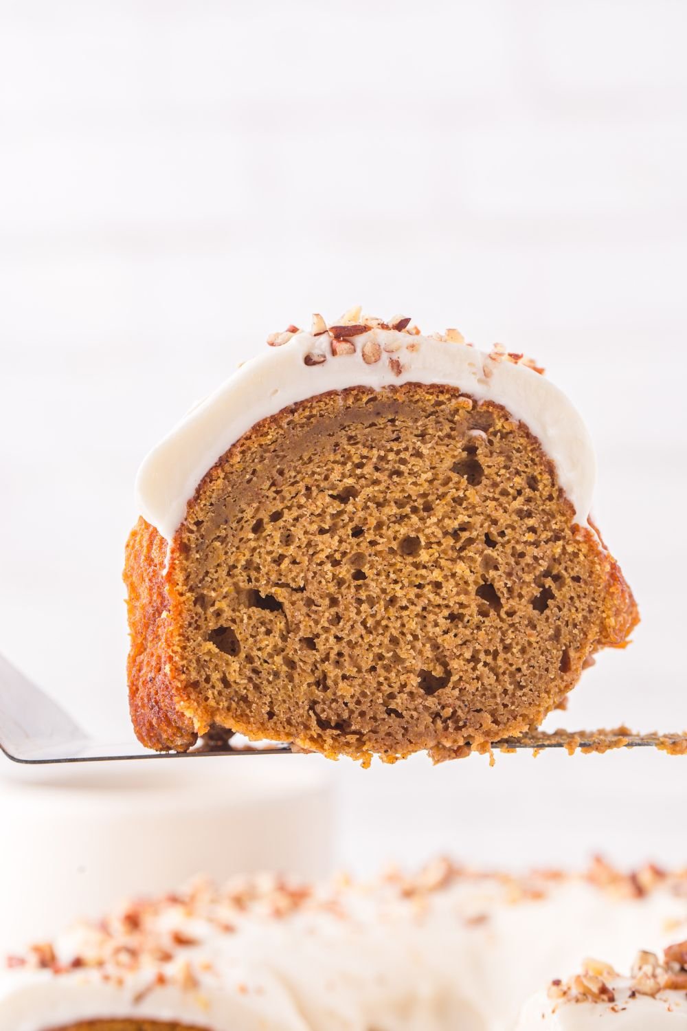 slice of Pumpkin Bundt Cake on a spatula 