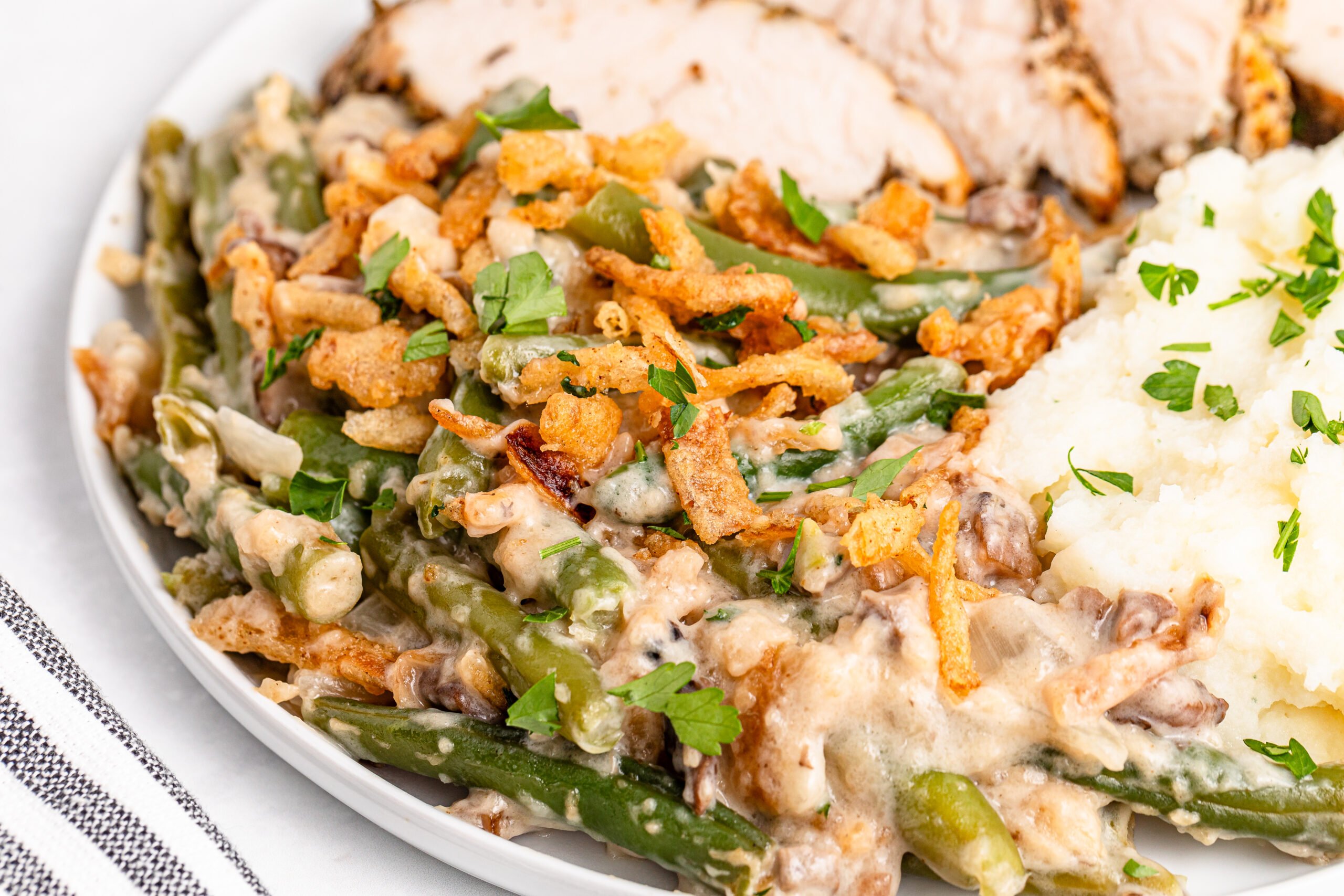 Up close of a plate filled with the Best Ever Green Bean Casserole