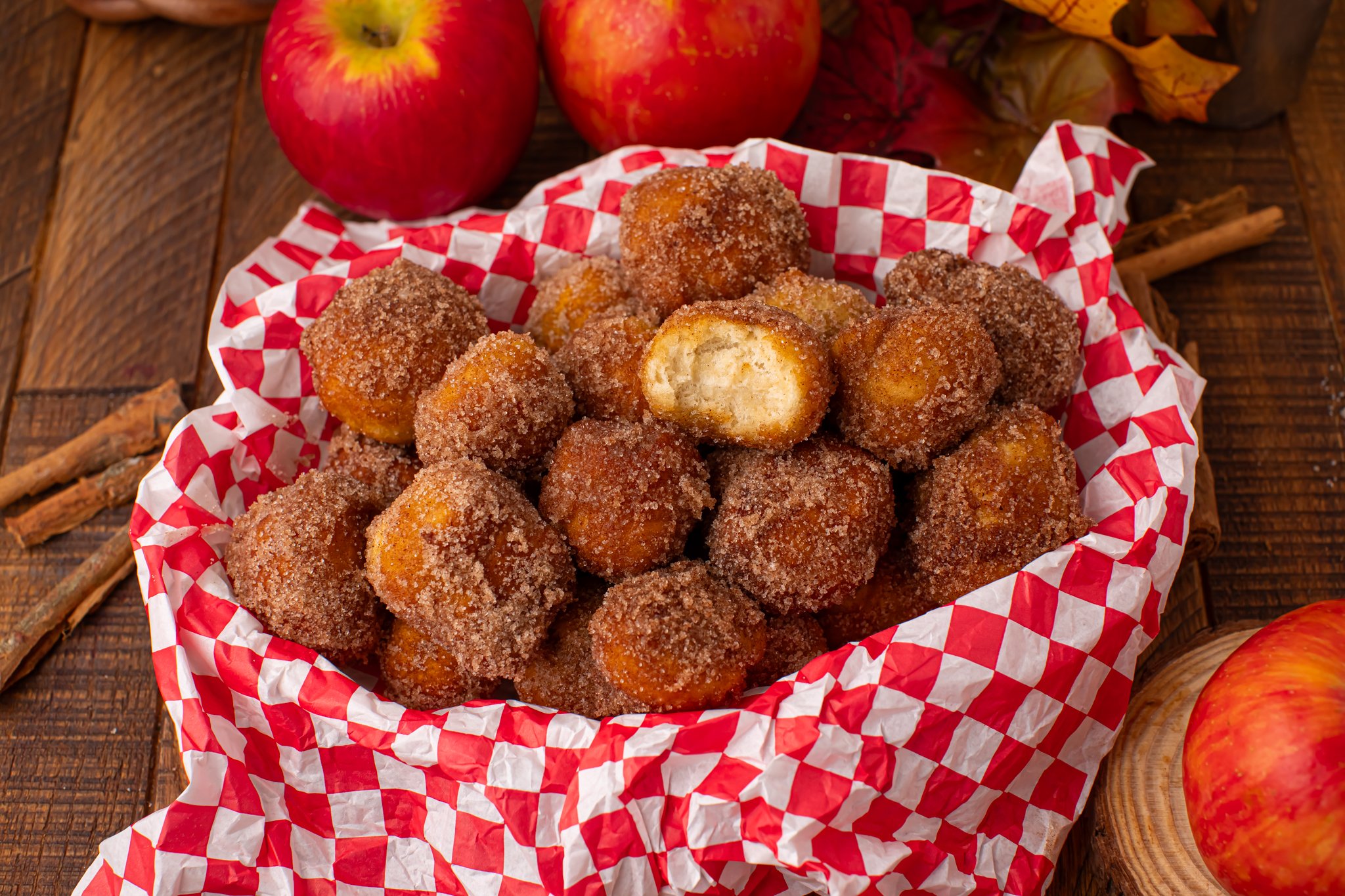 basket full of Apple Pie Donut Holes  in a checked serving basket 