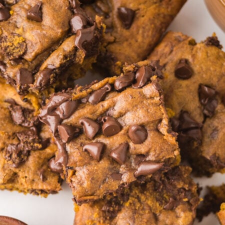 Brown Butter Pumpkin Chocolate Chip Bars stacked and sliced