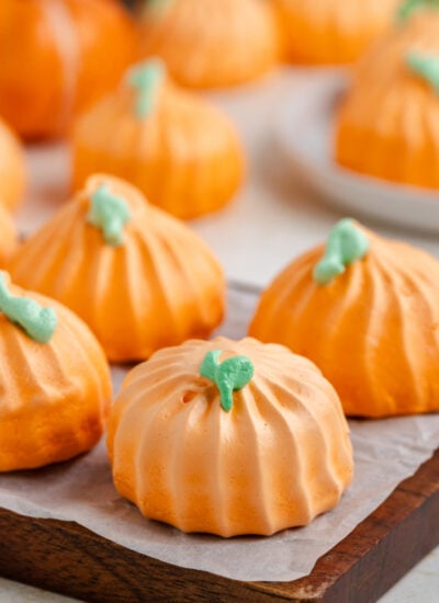 Pumpkin Meringue cookies on a dark wood serving board