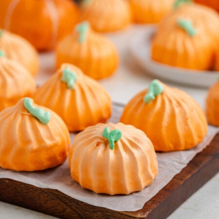 Pumpkin Meringue cookies on a dark wood serving board