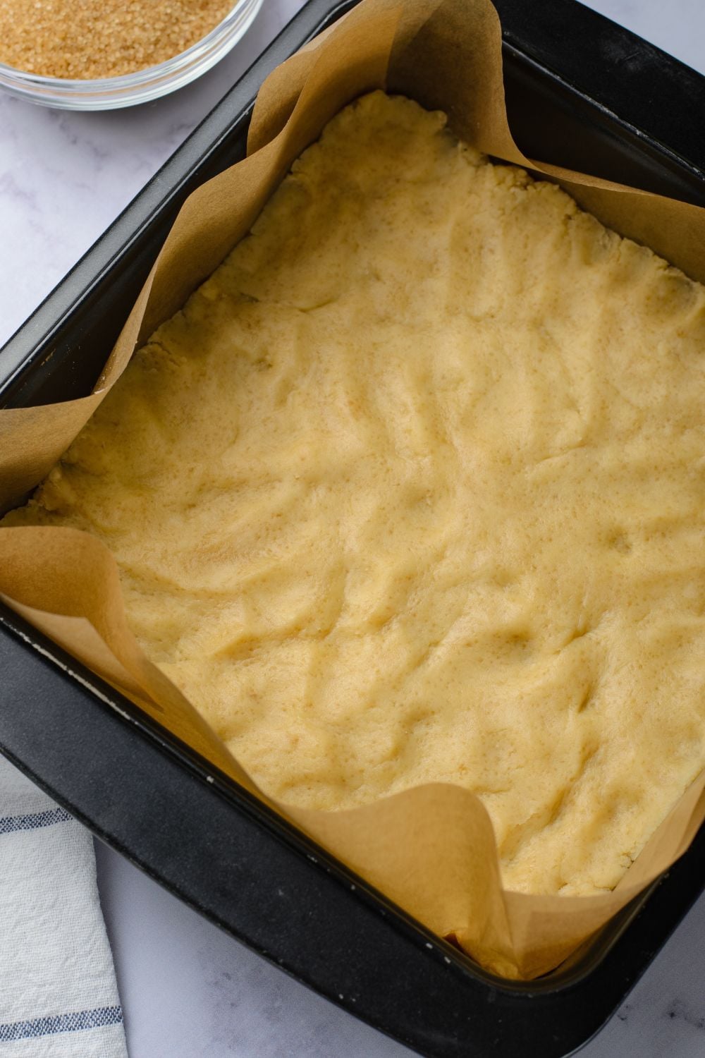 buttery crust pressed into a baking pan 