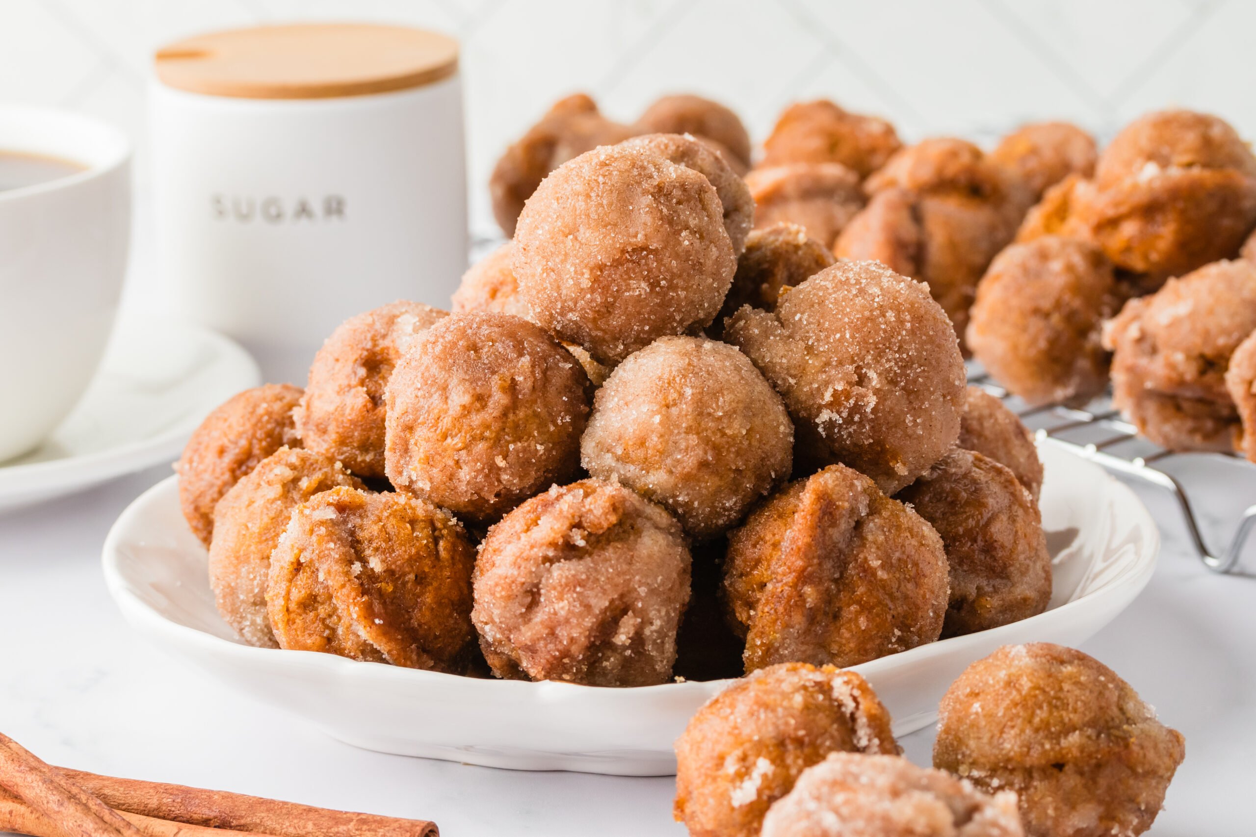 White plate with piled Pumpkin Spice Donut Holes 