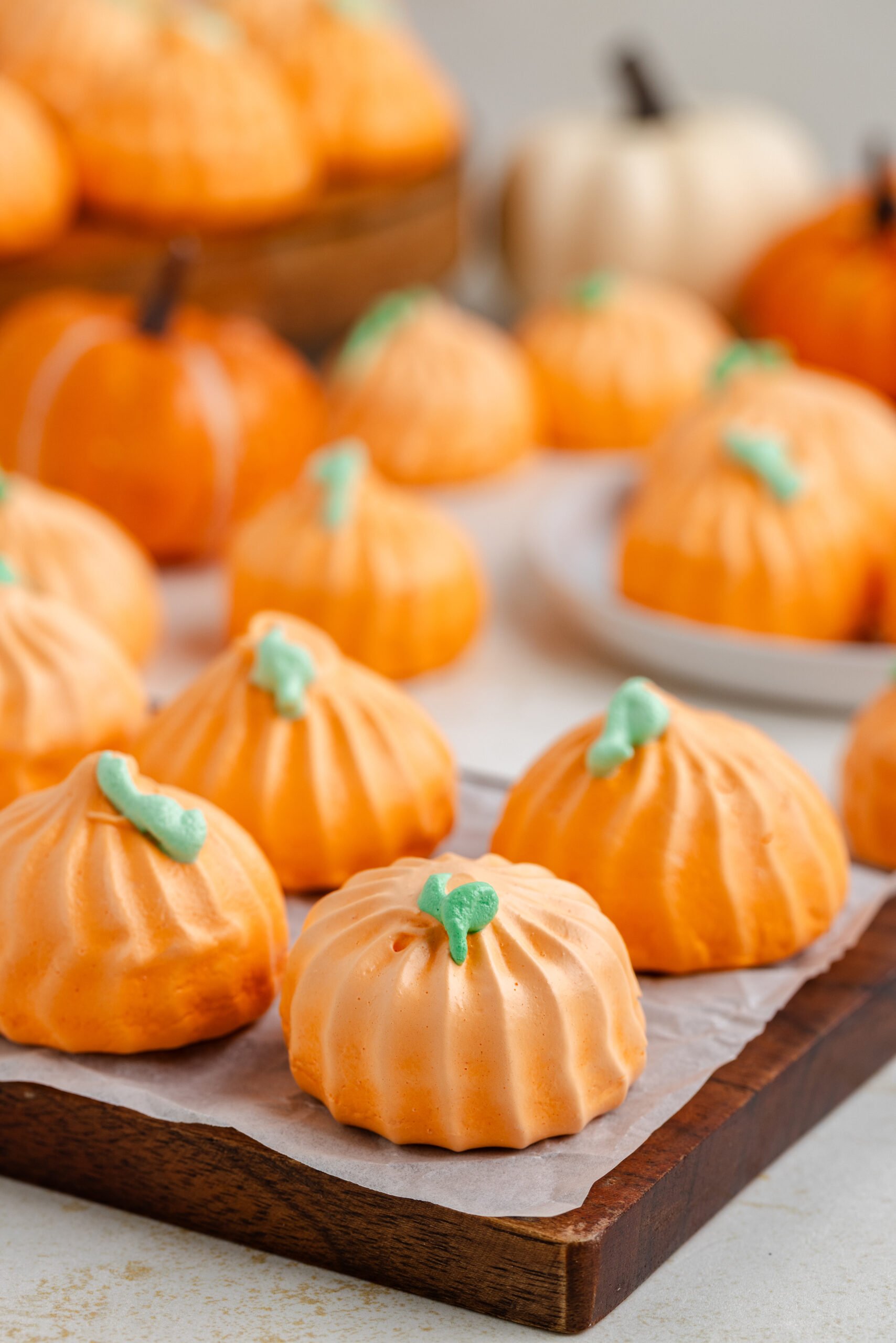 Pumpkin Meringue cookies on a dark wood board