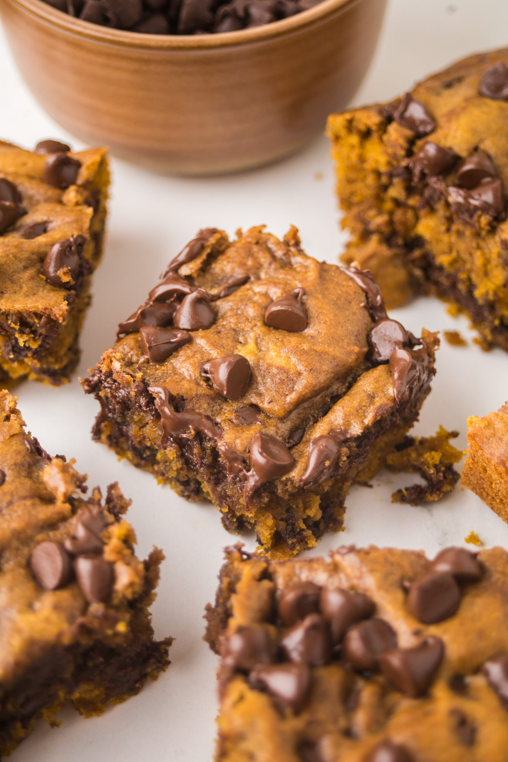 Brown Butter Pumpkin Chocolate Chip Bars  sliced on a table 