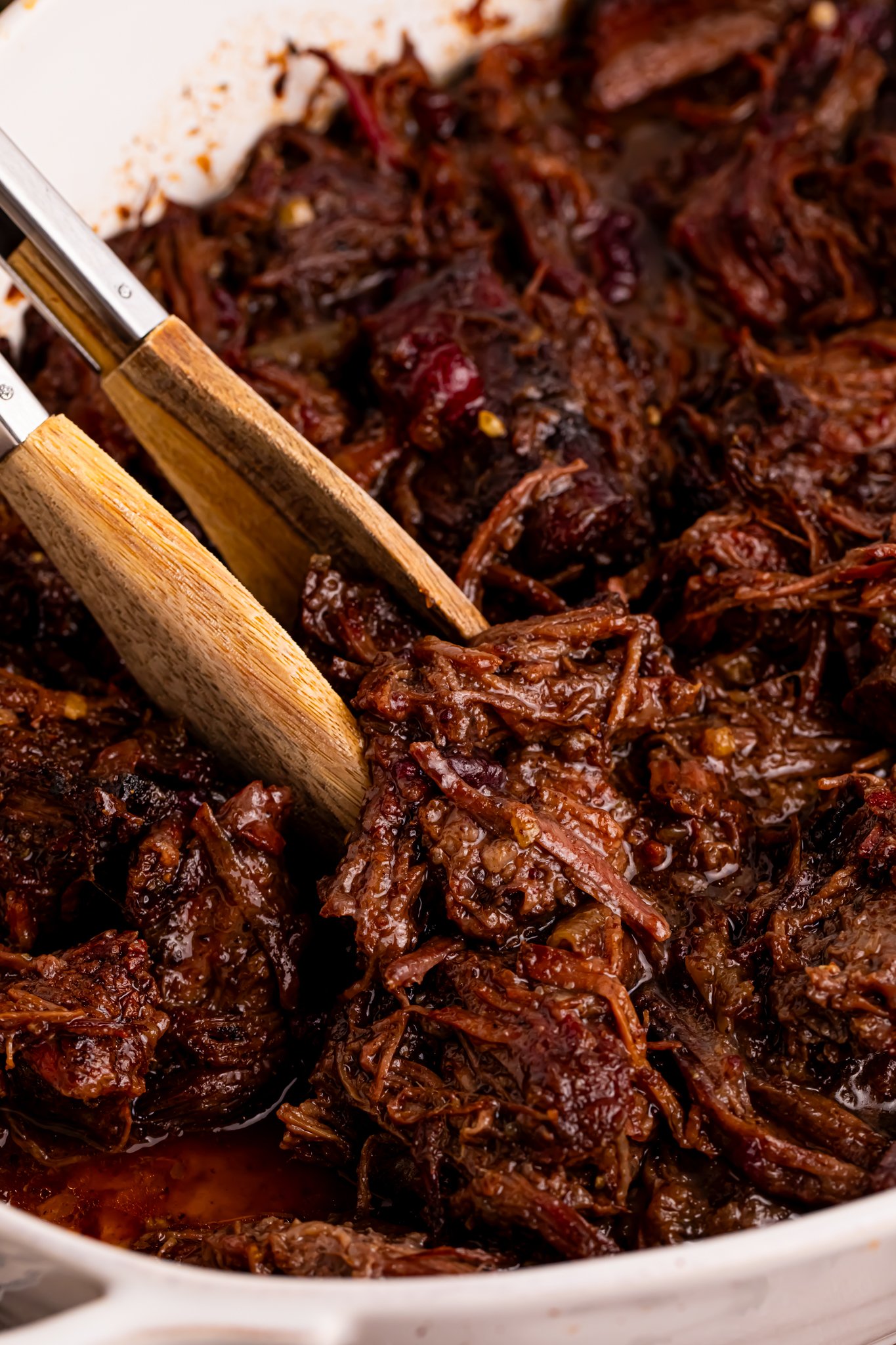 Cranberry Pot Roast shredded in a baking dish 