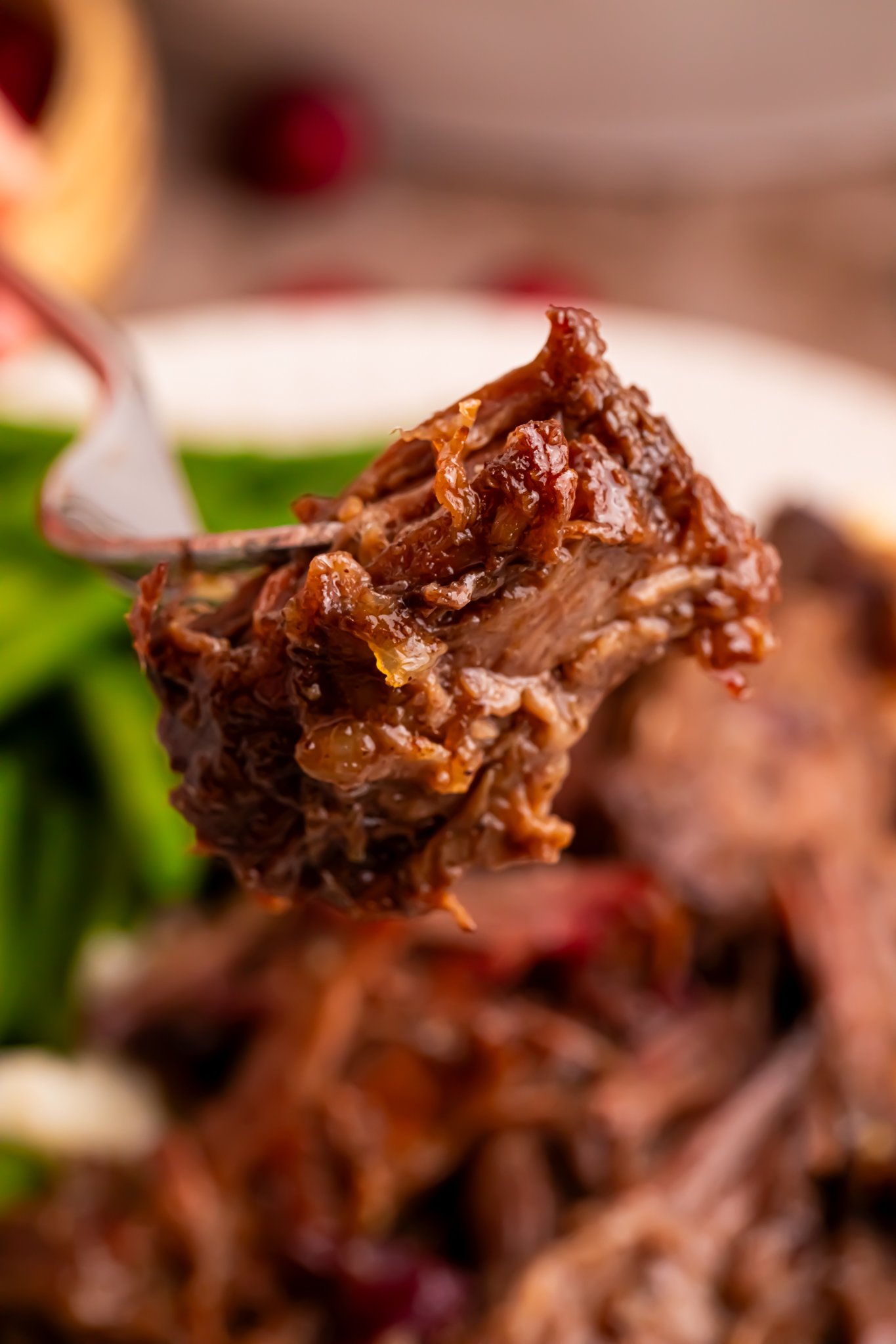Cranberry Pot Roast shredded on a fork 