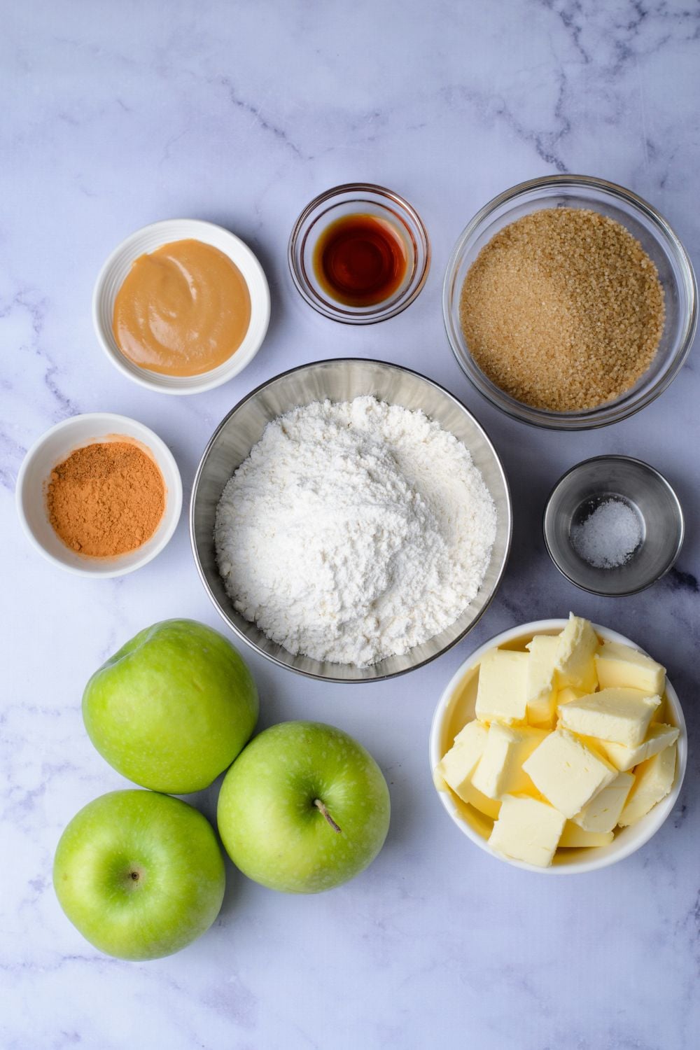 all the ingredients for making Caramel Apple Pie Bars in single serve containers 