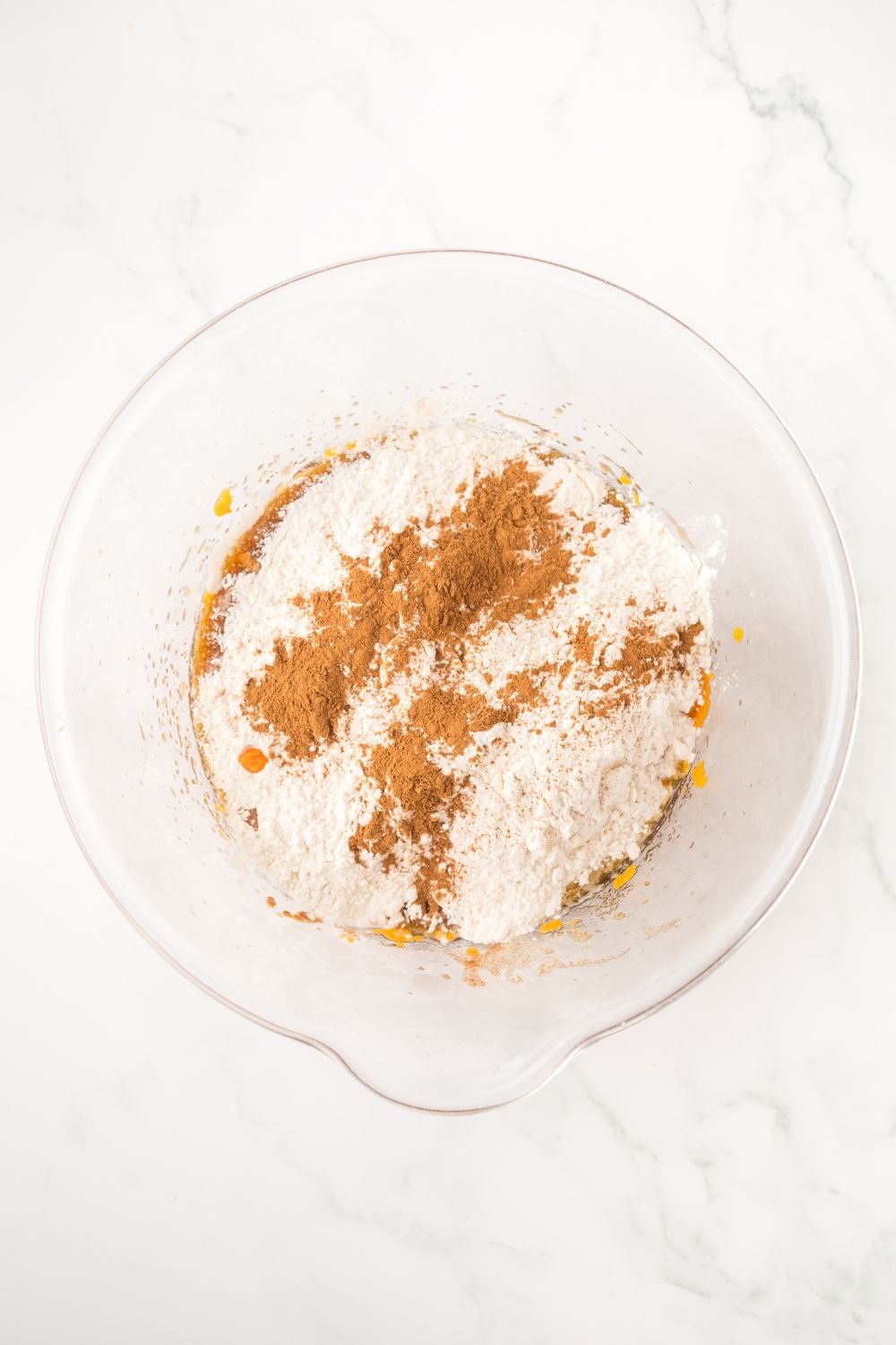 glass bowl with dry ingredients for making Brown Butter Pumpkin Chocolate Chip Bars