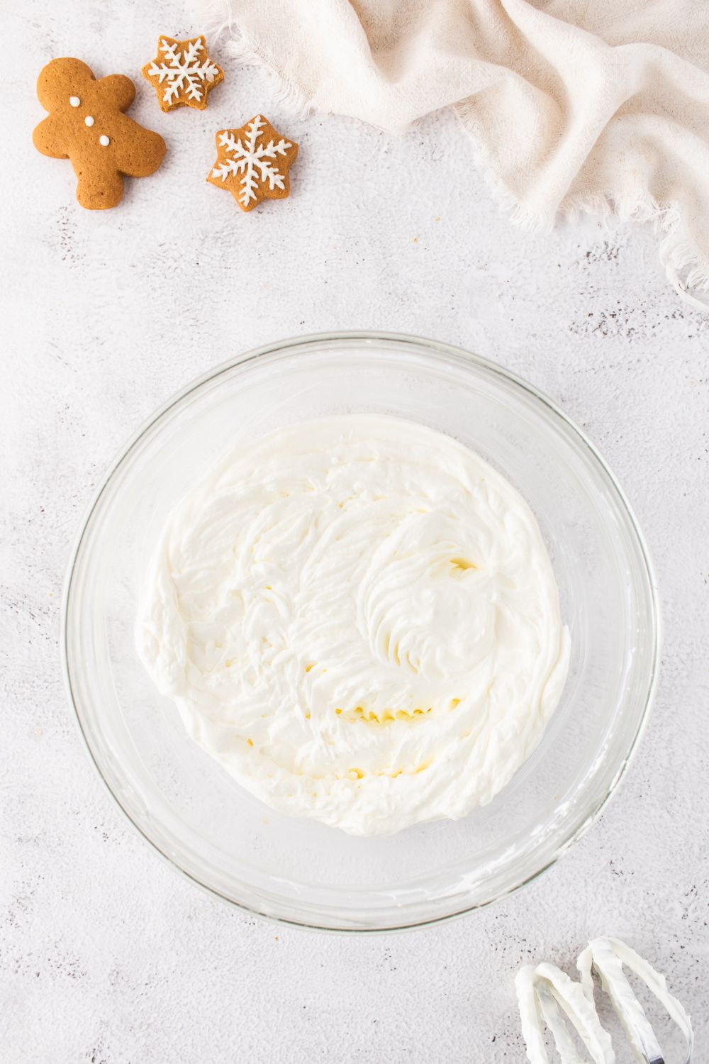 cheesecake batter in a glass bowl on table 