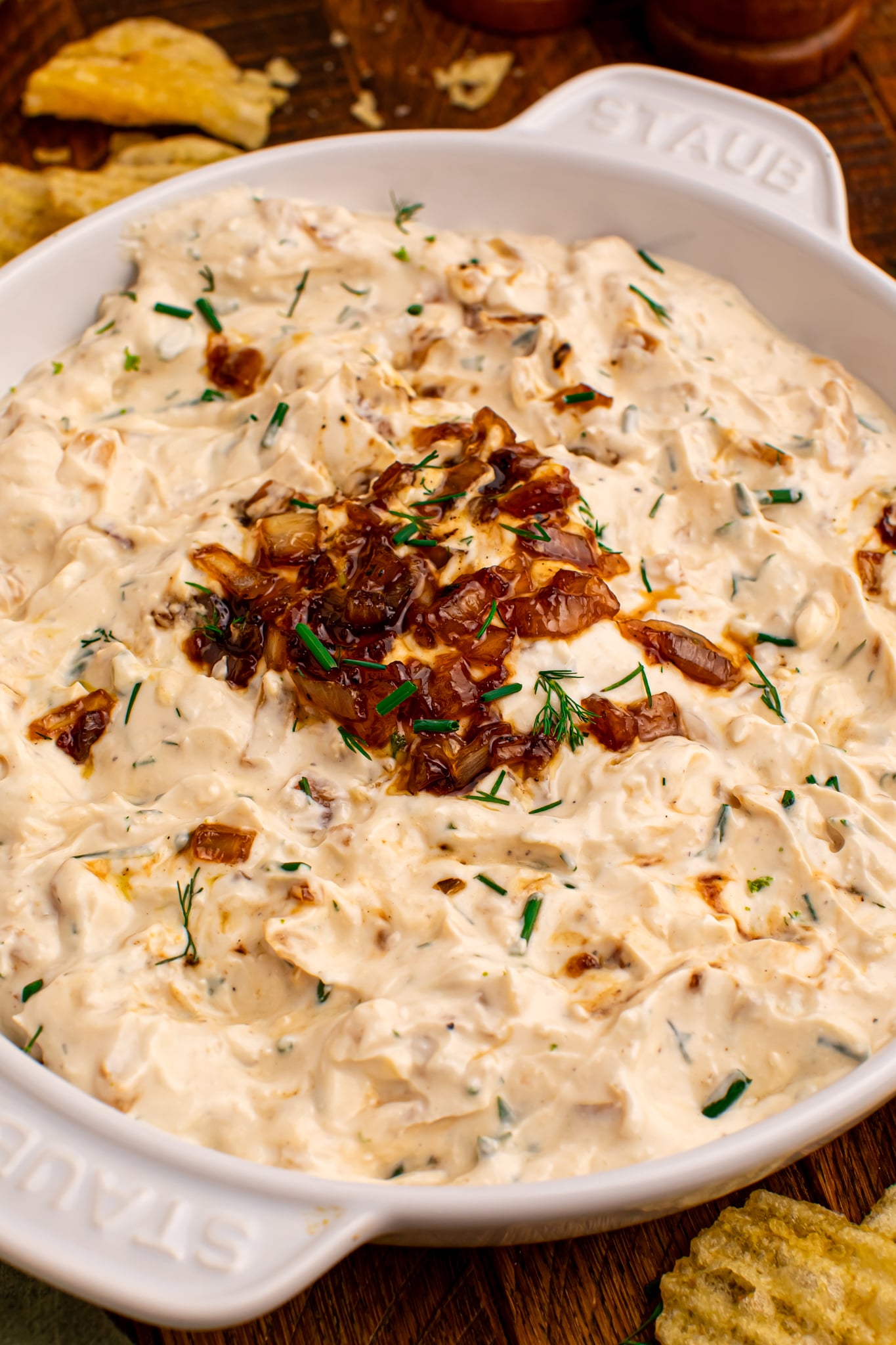 close up shot of Caramelized Onion Chip Dip in a white staub bowl 