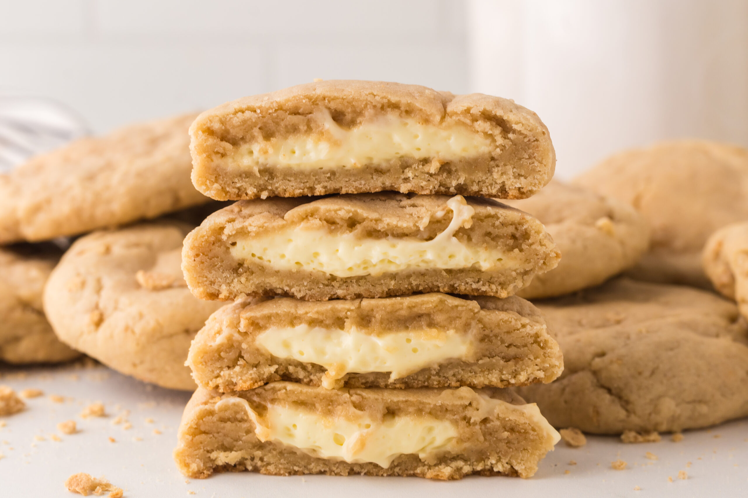 New York cheesecake stuffed cookies stacked on top of one another 