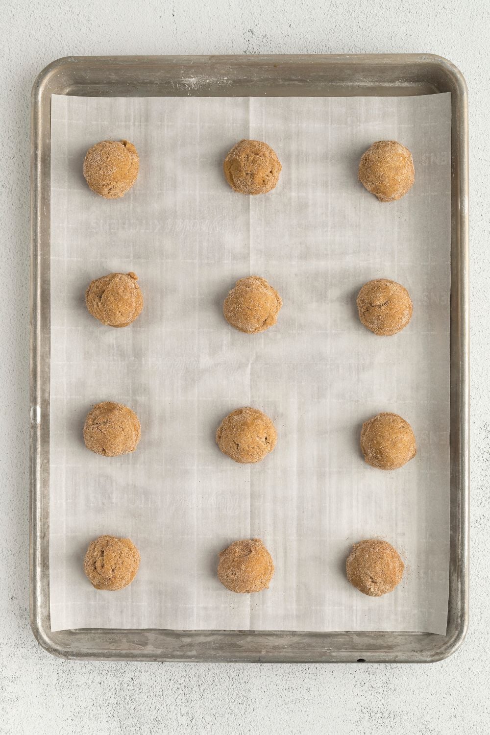 balls of cookie dough on baking tray 