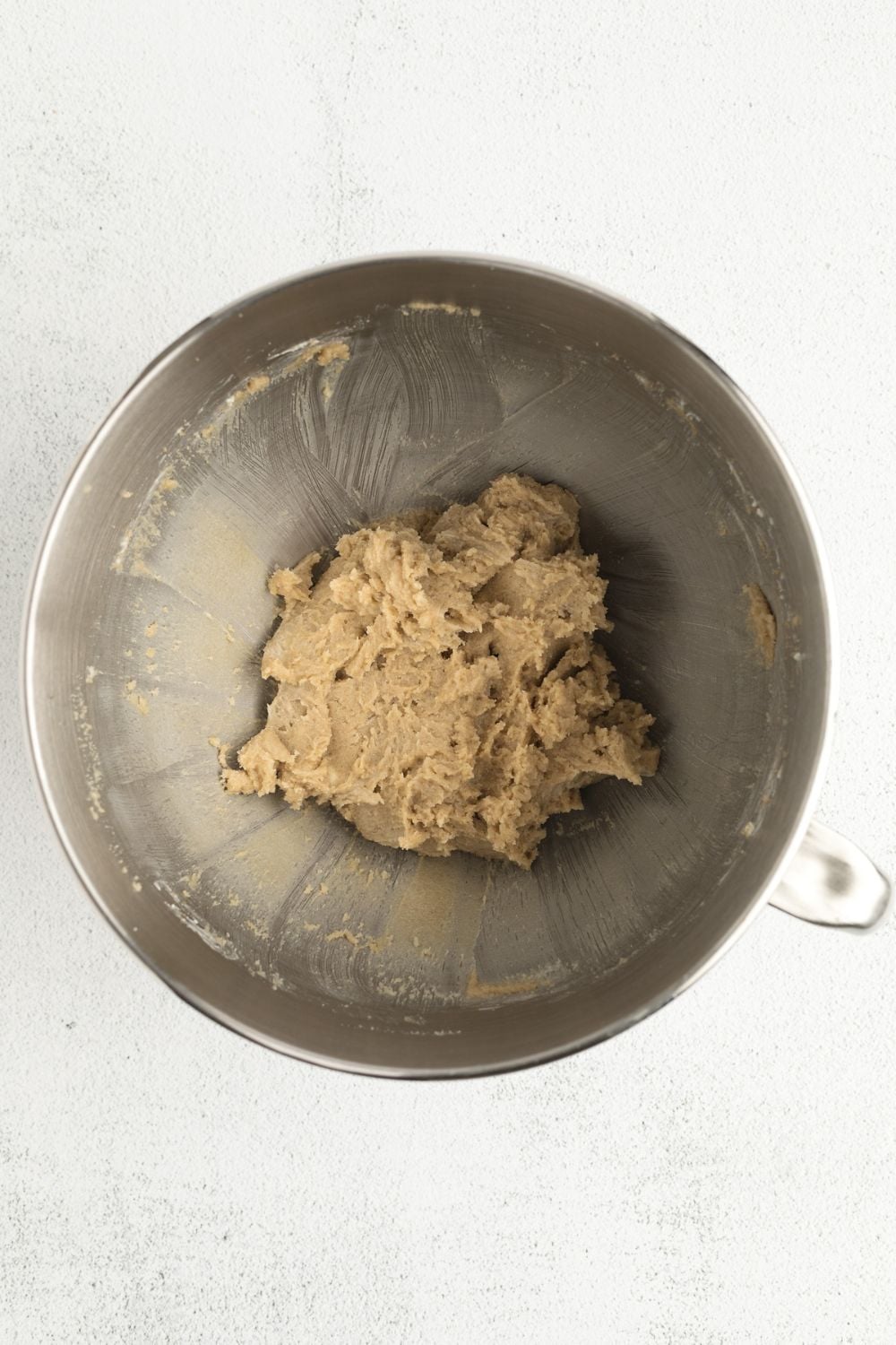butter and sugar mixed in a metal bowl