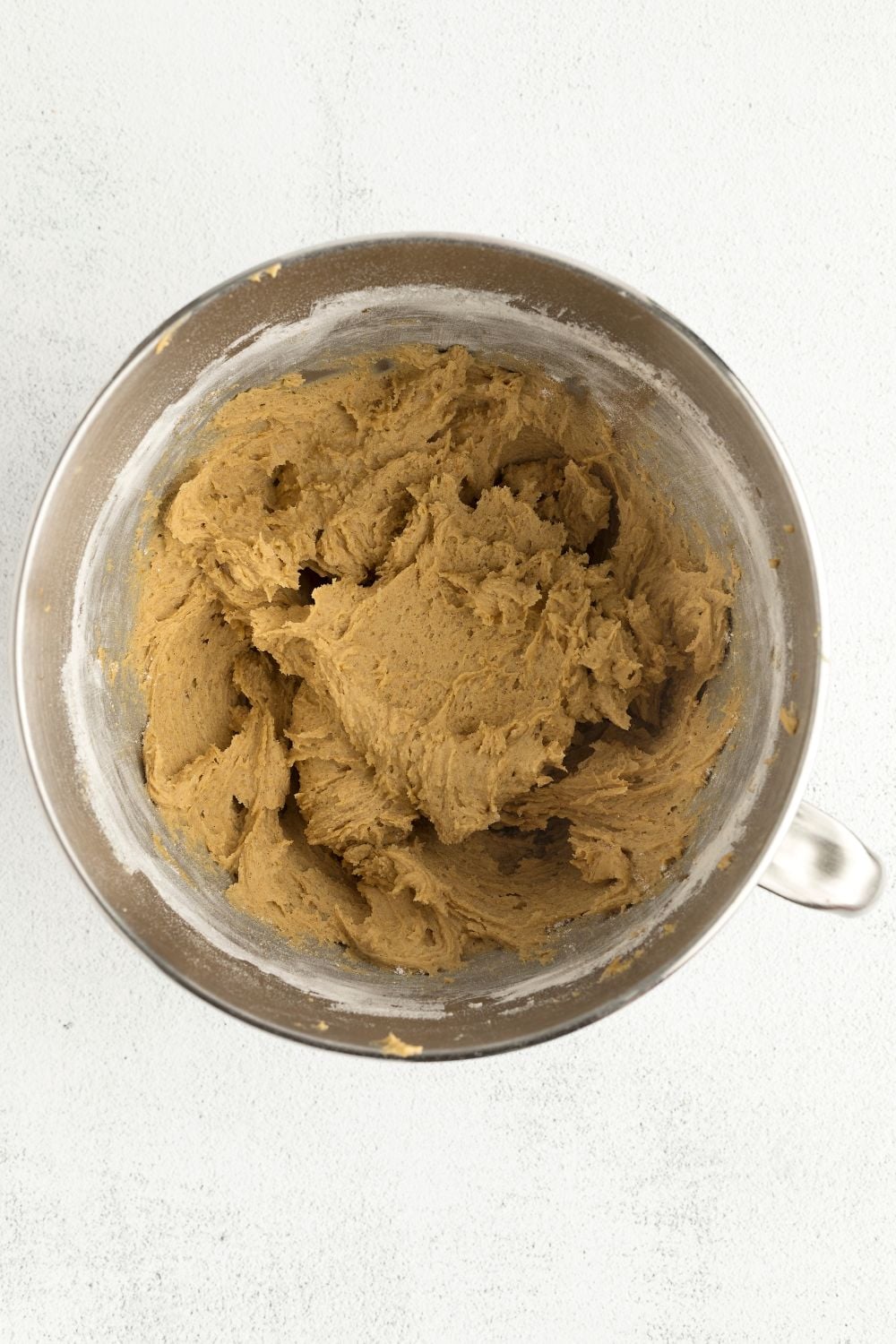 pumpkin cookie batter in a metal bowl 