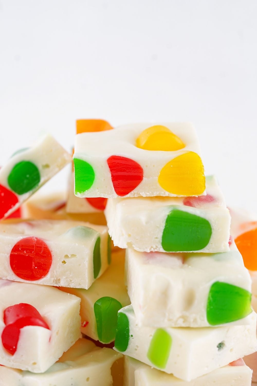 Christmas Gumdrop Nougat Candy stacked on top of one another with white background 