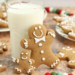 Christmas Gingerbread Cookies (No-Spread Cut-Outs – Gluten-Free Option!) learned up against a glass of milk on table