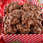 Crockpot Christmas Candy in a red tin on a red table