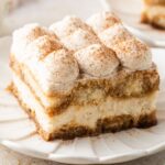 slice of Eggnog Tiramisu on a white plate on table