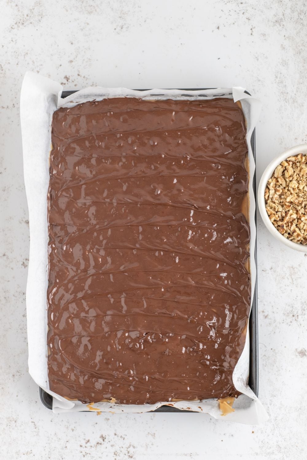 chocolate spread over the top of toffee 