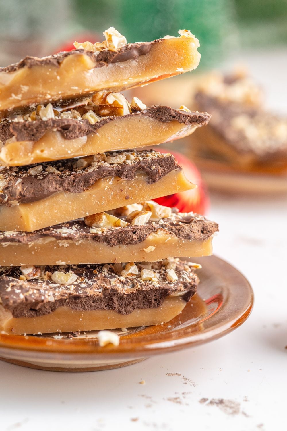 stack of English Toffee on a plate on a white table 