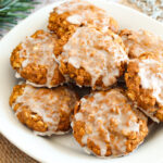 Iced Gingerbread Oatmeal Cookies (Gluten Free) on a white plate