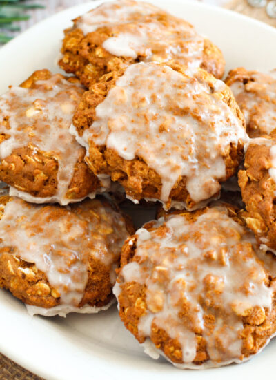 Iced Gingerbread Oatmeal Cookies (Gluten Free) on a white plate