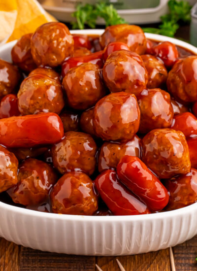 Crockpot Teriyaki BBQ Cocktail Meatballs & Lil Smokies in a large white serving bowl
