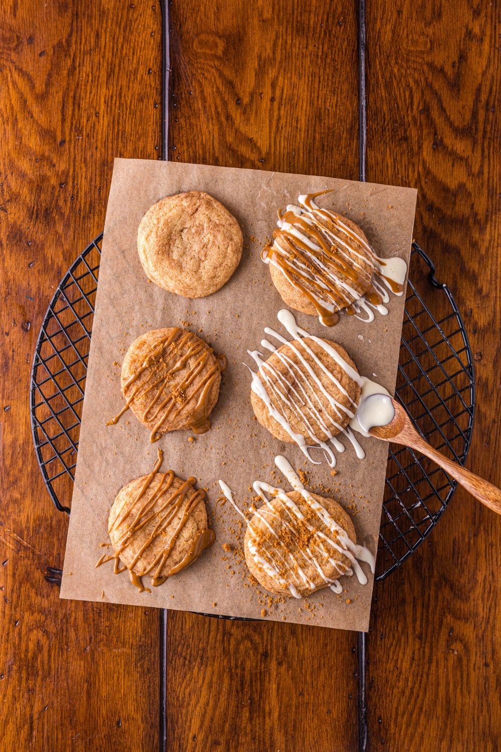 Biscoff Snickerdoodle Cookies drizzled with cookie butter and white chocolate on top of each cookies