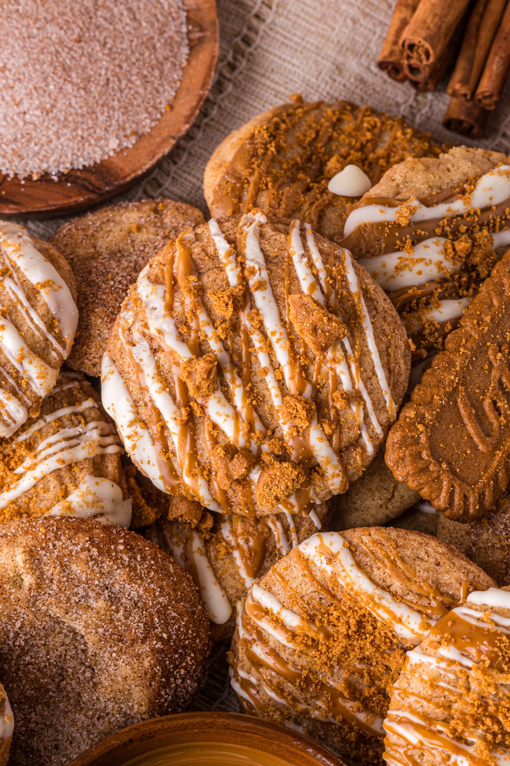 Biscoff Snickerdoodle Cookies spread around the table  with cookies 