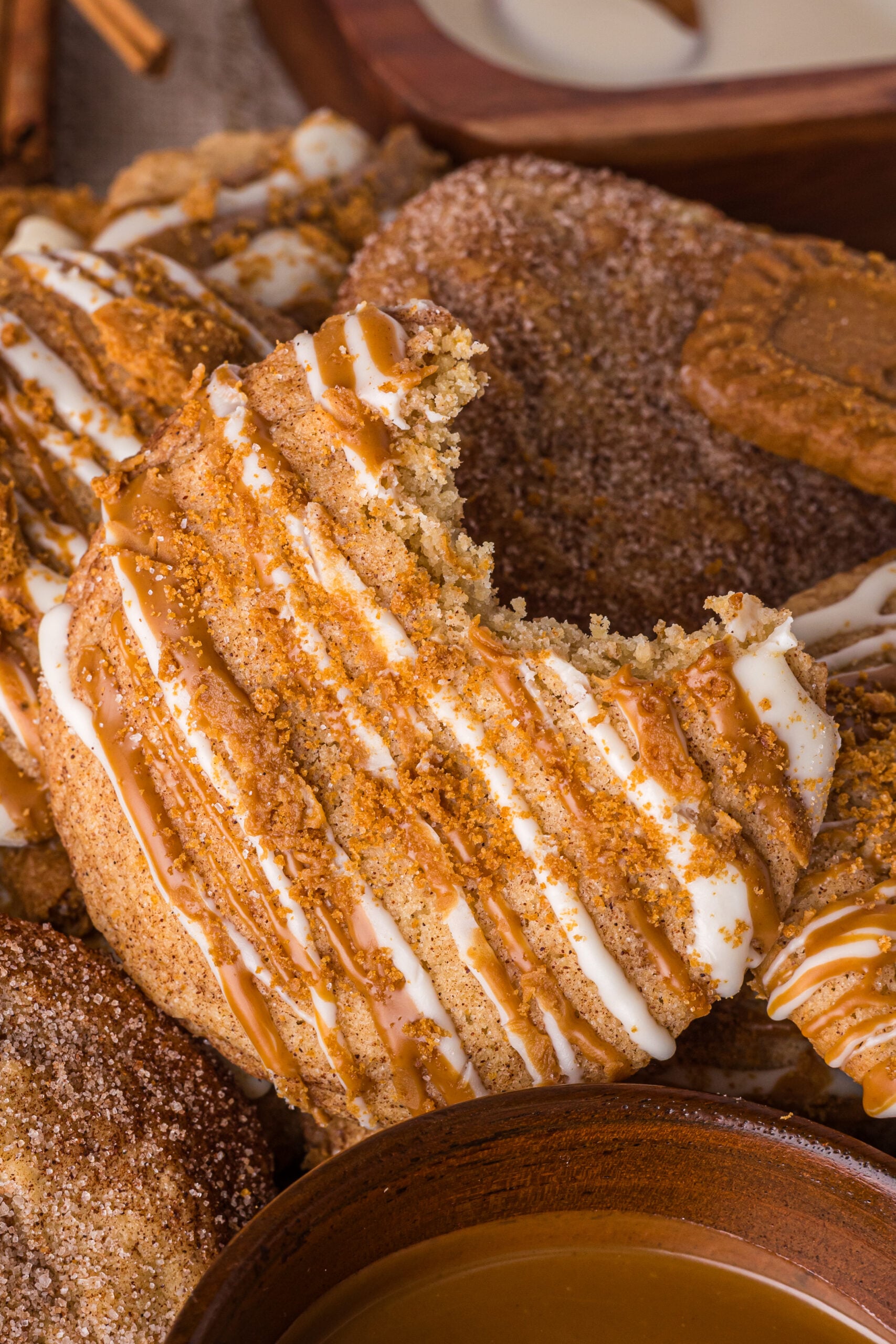Biscoff Snickerdoodle Cookie with a bite missing out of it 