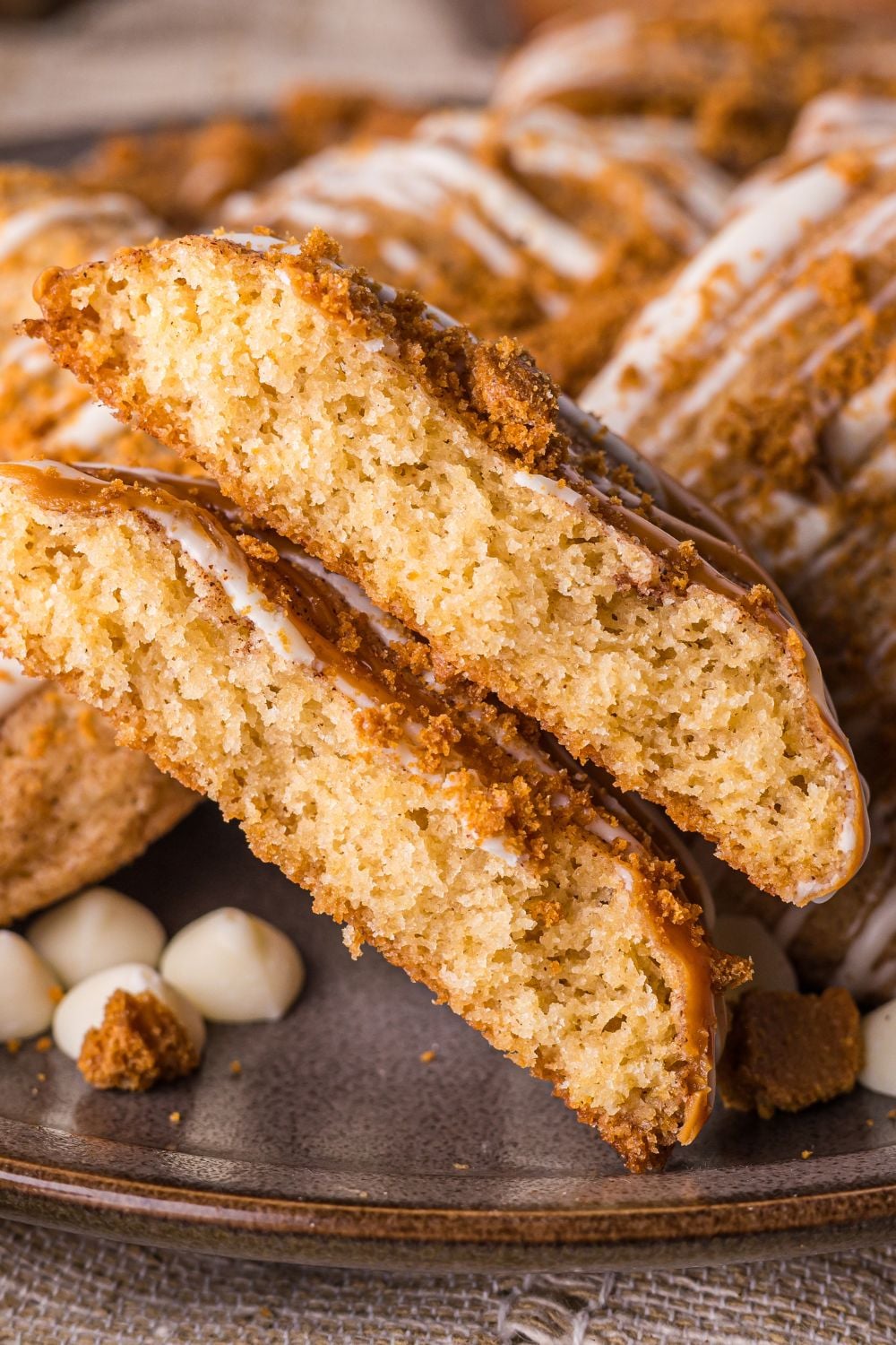 Biscoff Snickerdoodle Cookies on plate with one cookie cut in half 