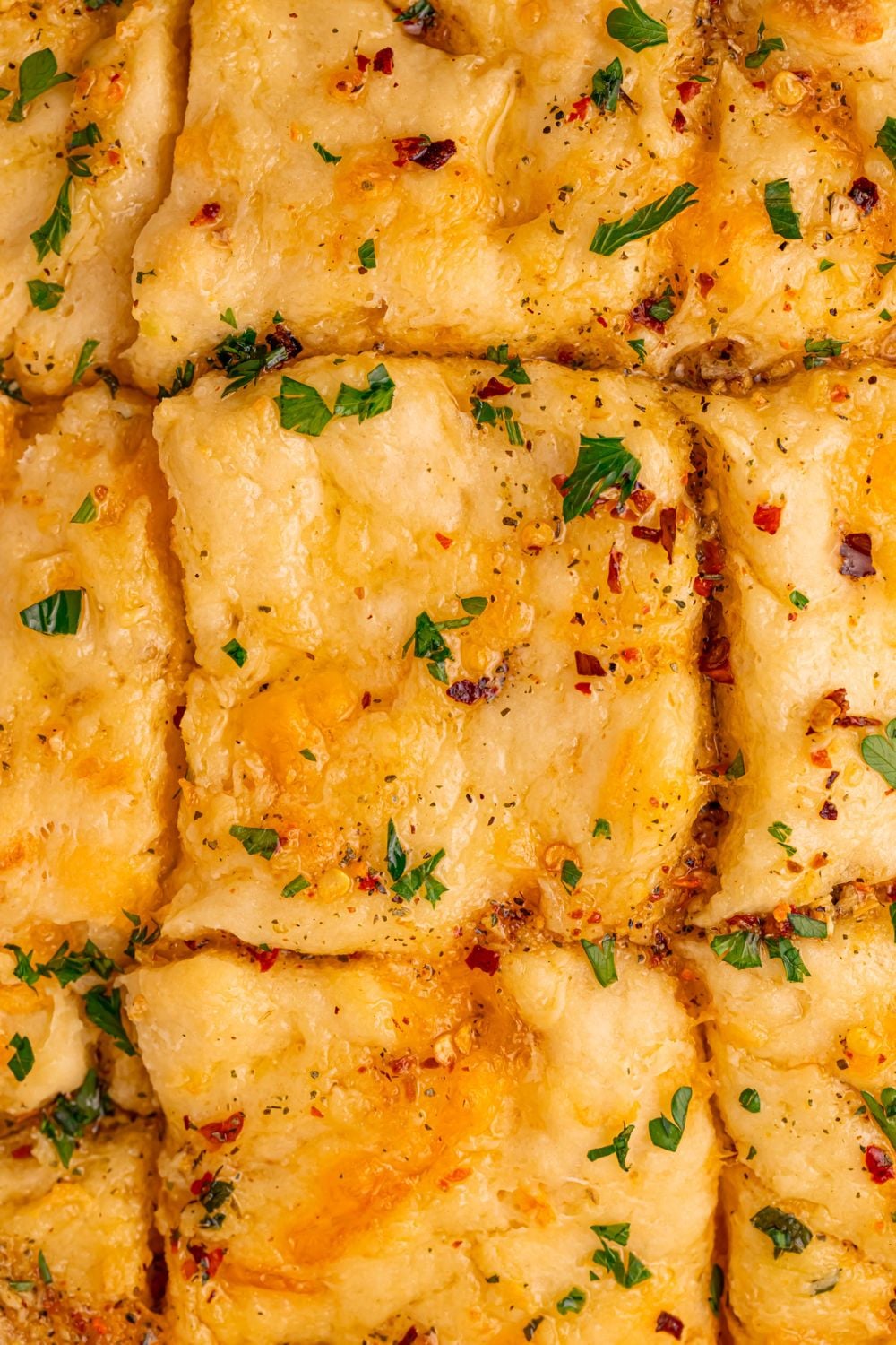 looking down on pan with sliced Cowboy Butter Swim Biscuits baked in it 