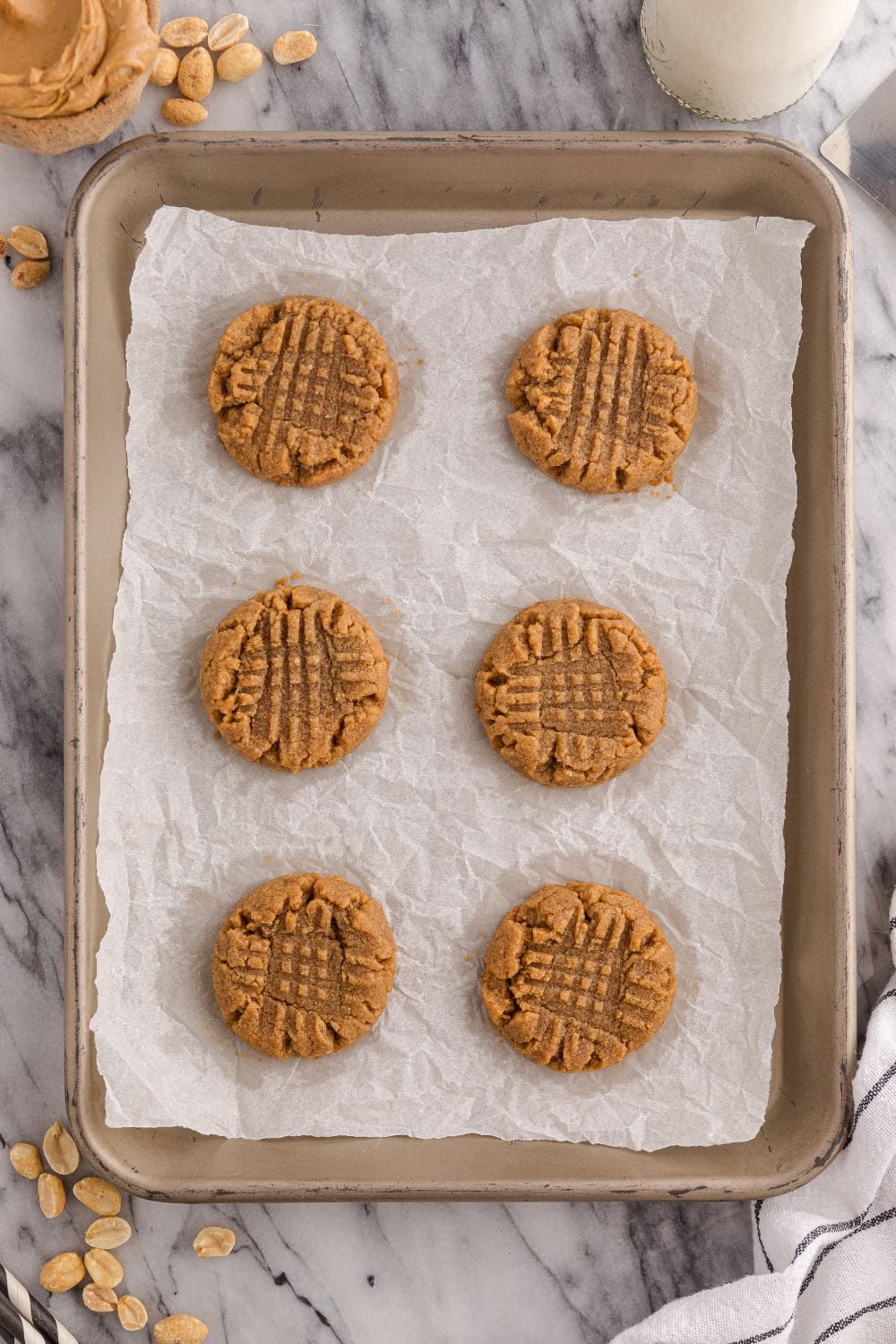 sheet pan with baked 4 Ingredient Peanut Butter Cookies on a cookie tray 
