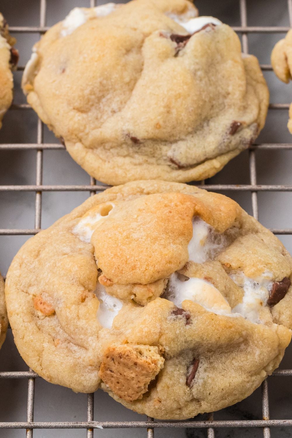 S'mores Cookies on a cooling rack placed in a single row