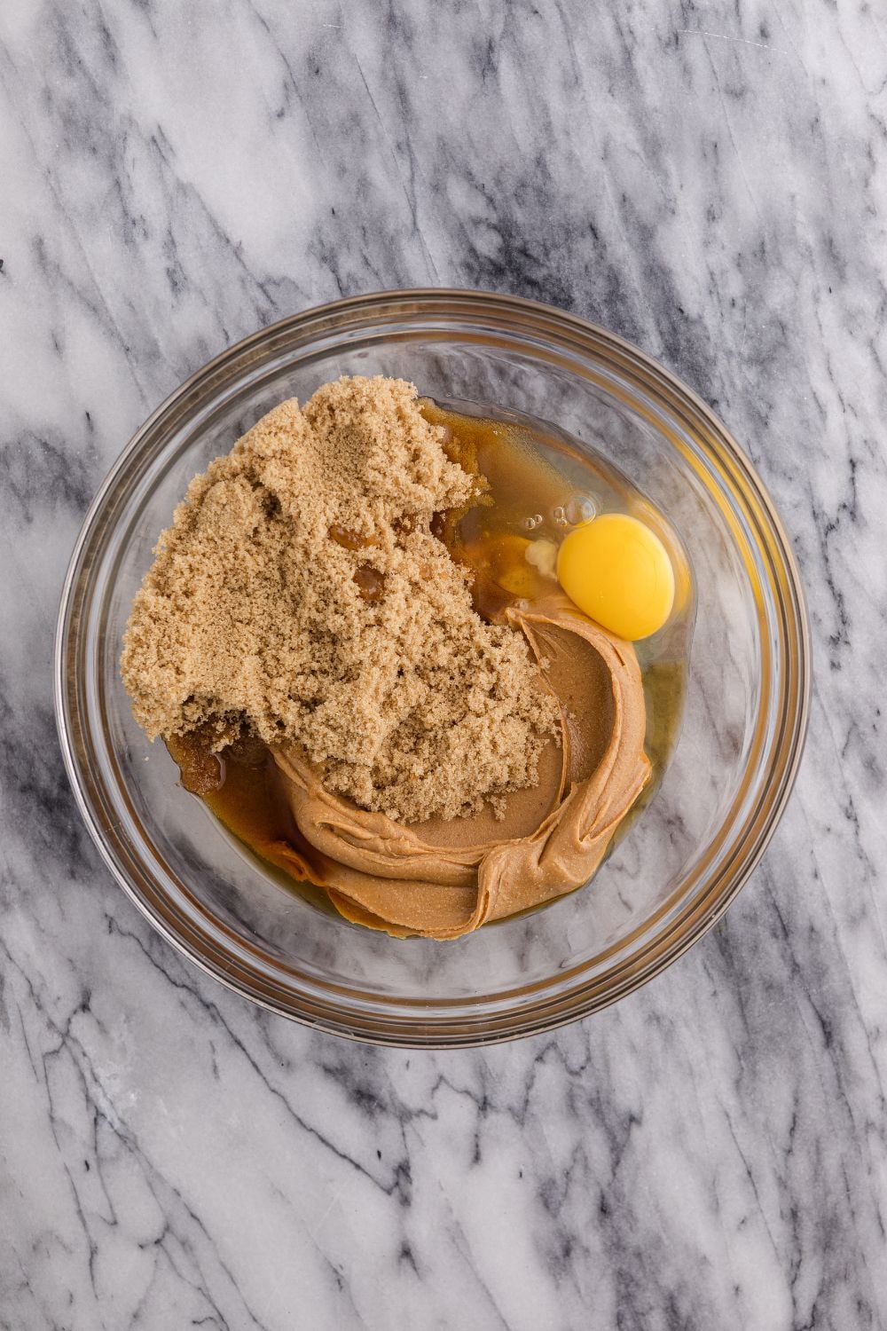 peanut butter and egg mixture in a glass bowl