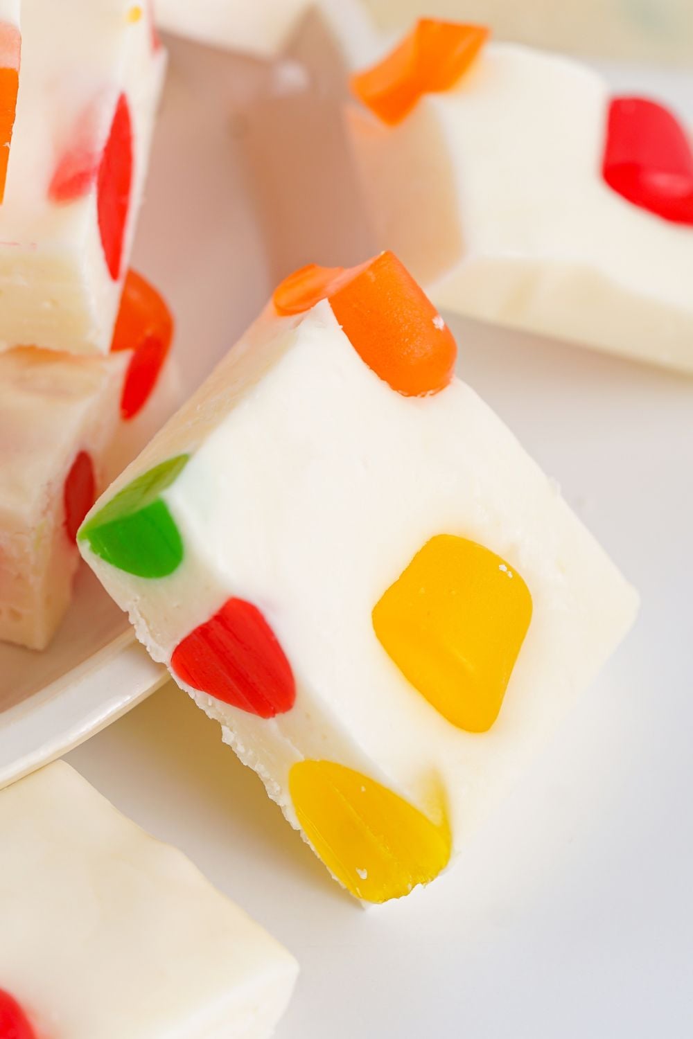 Christmas Gumdrop Nougat Candy on a white table with candy spread around 