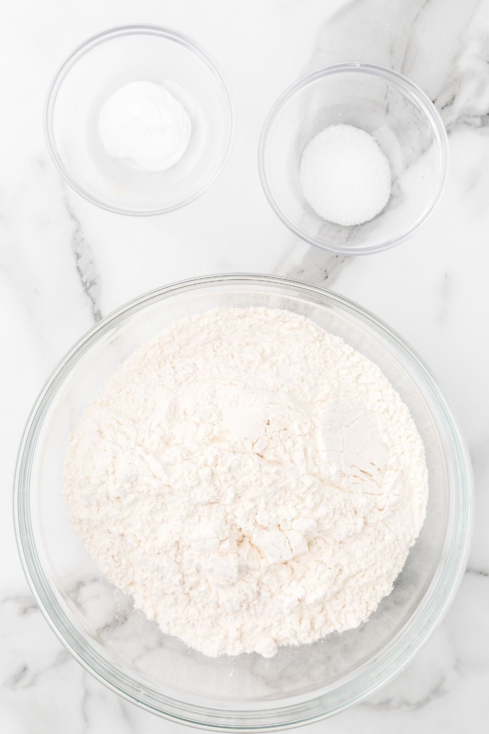 dry ingredients in bowl on marble counter in glass bowls 