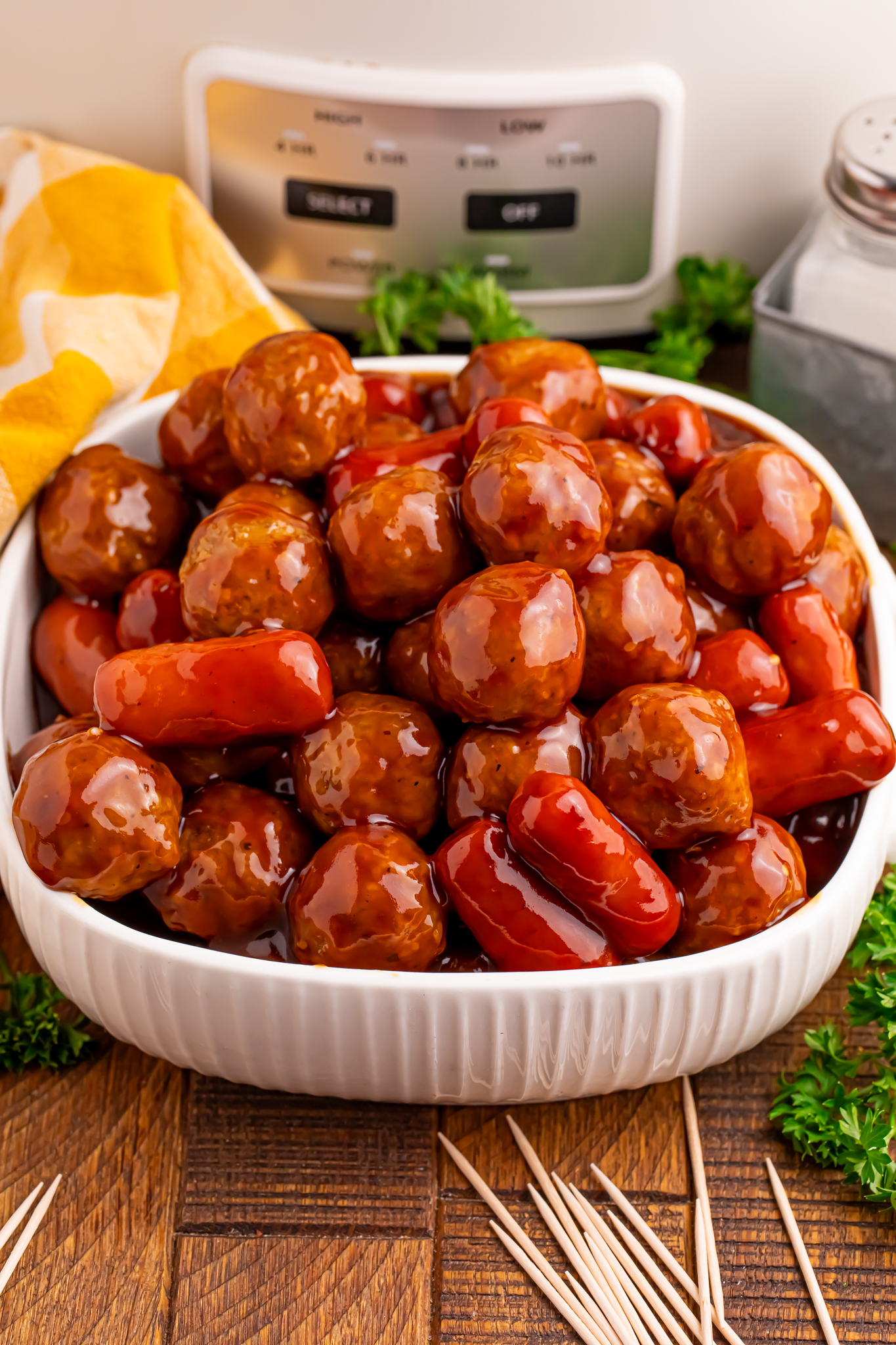 Crockpot Teriyaki BBQ Cocktail Meatballs & Lil Smokies in a large white serving bowl 