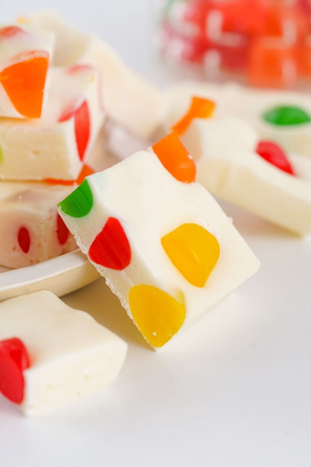 white plate you have stack of Christmas Gumdrop Nougat Candy on a tray 