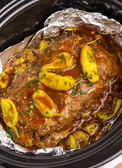 Crockpot Mississippi Meatloaf in a black slow cooker lined with foil