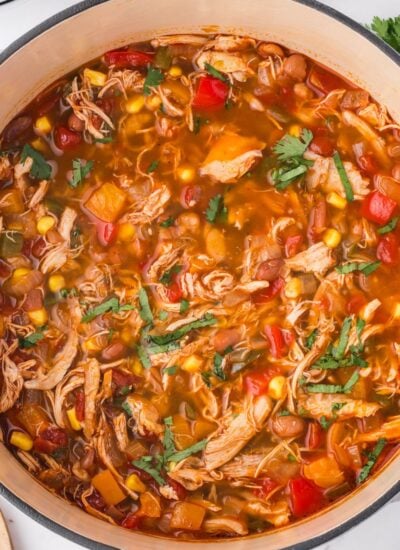 Southwestern Chicken Soup in a red and white pot on a table