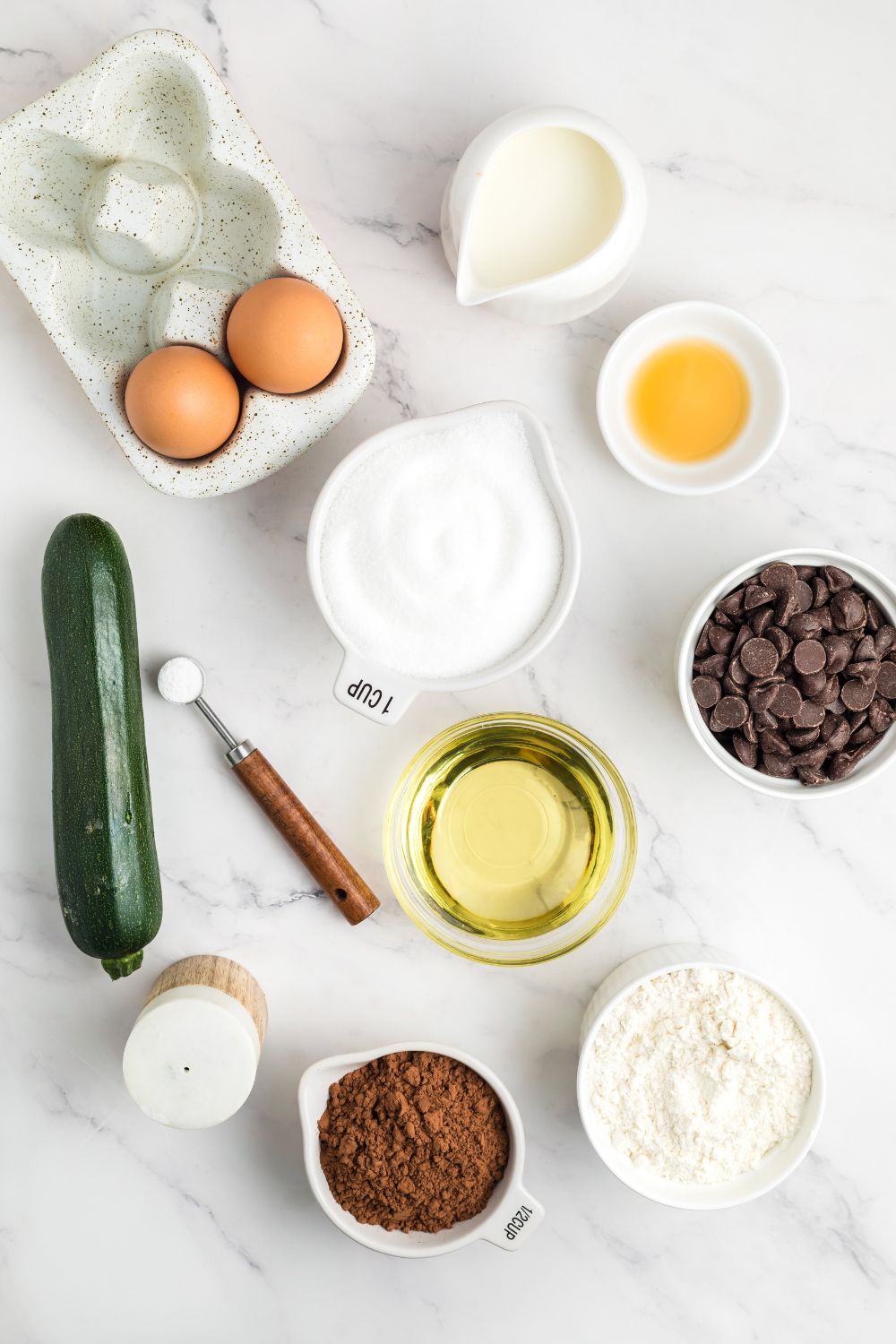 all the ingredients for Double Chocolate Zucchini Bread spread out on the table