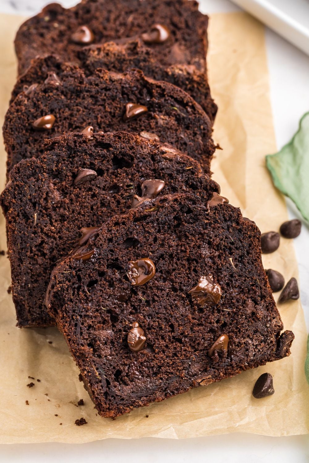 Double Chocolate Zucchini Bread sliced and spread out on a cutting board