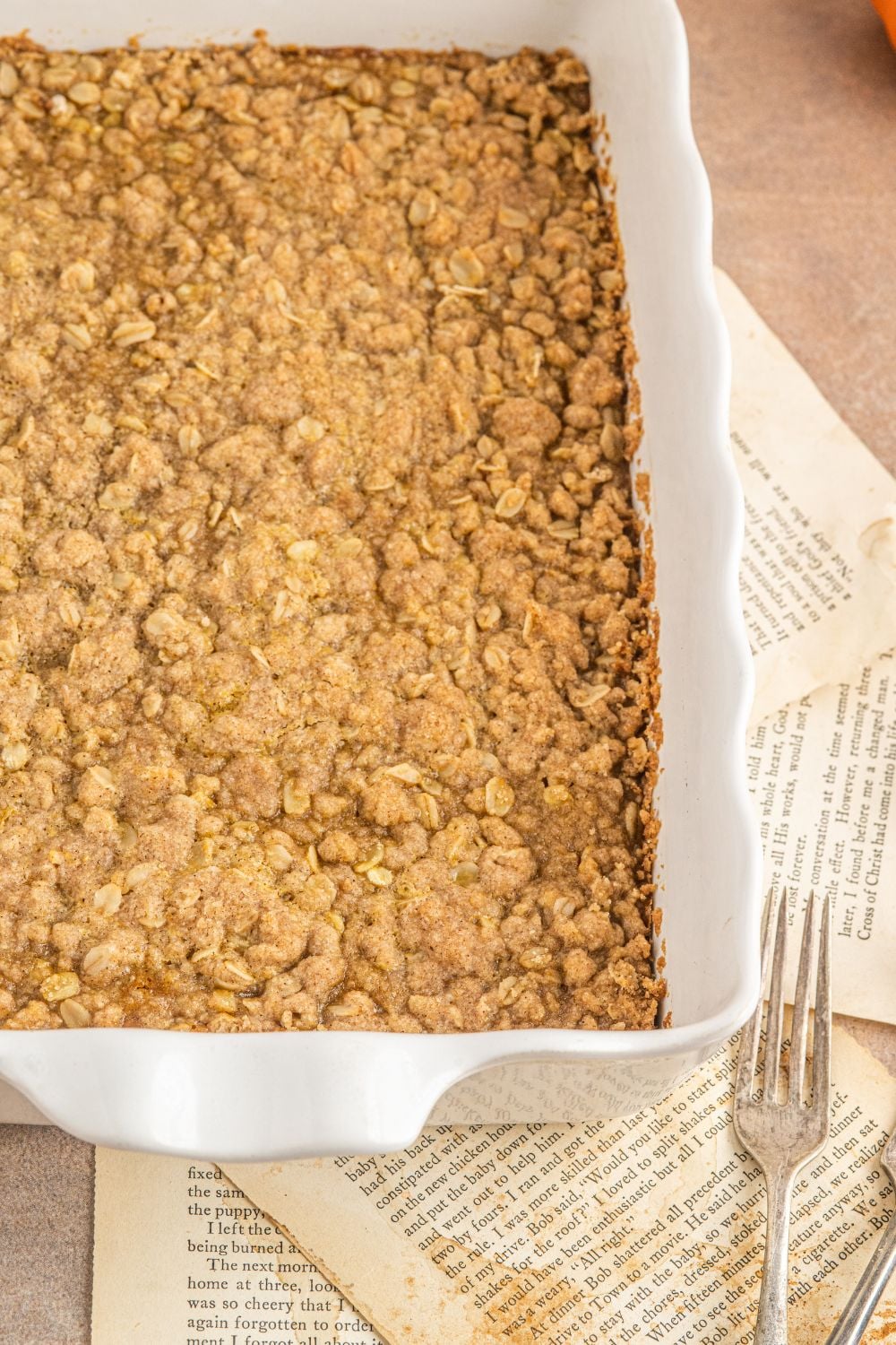 side view of Homemade Pumpkin Crisp in a pan sitting on the counter 