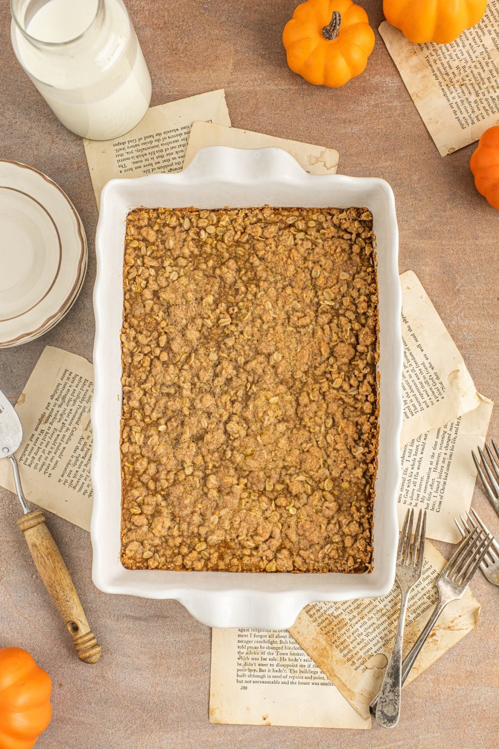 looking down on table with towels and a casserole dish full of fresh baked Homemade Pumpkin Crisp